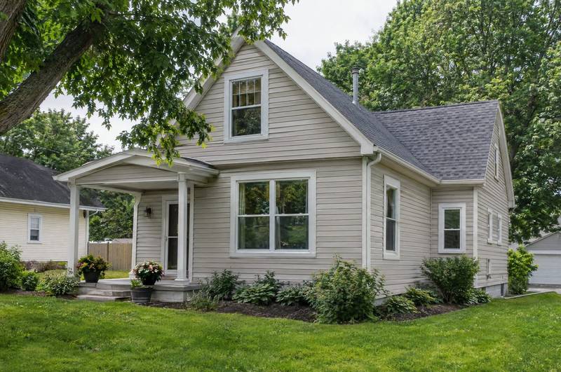 House exterior with horizontal lap siding and white window trim